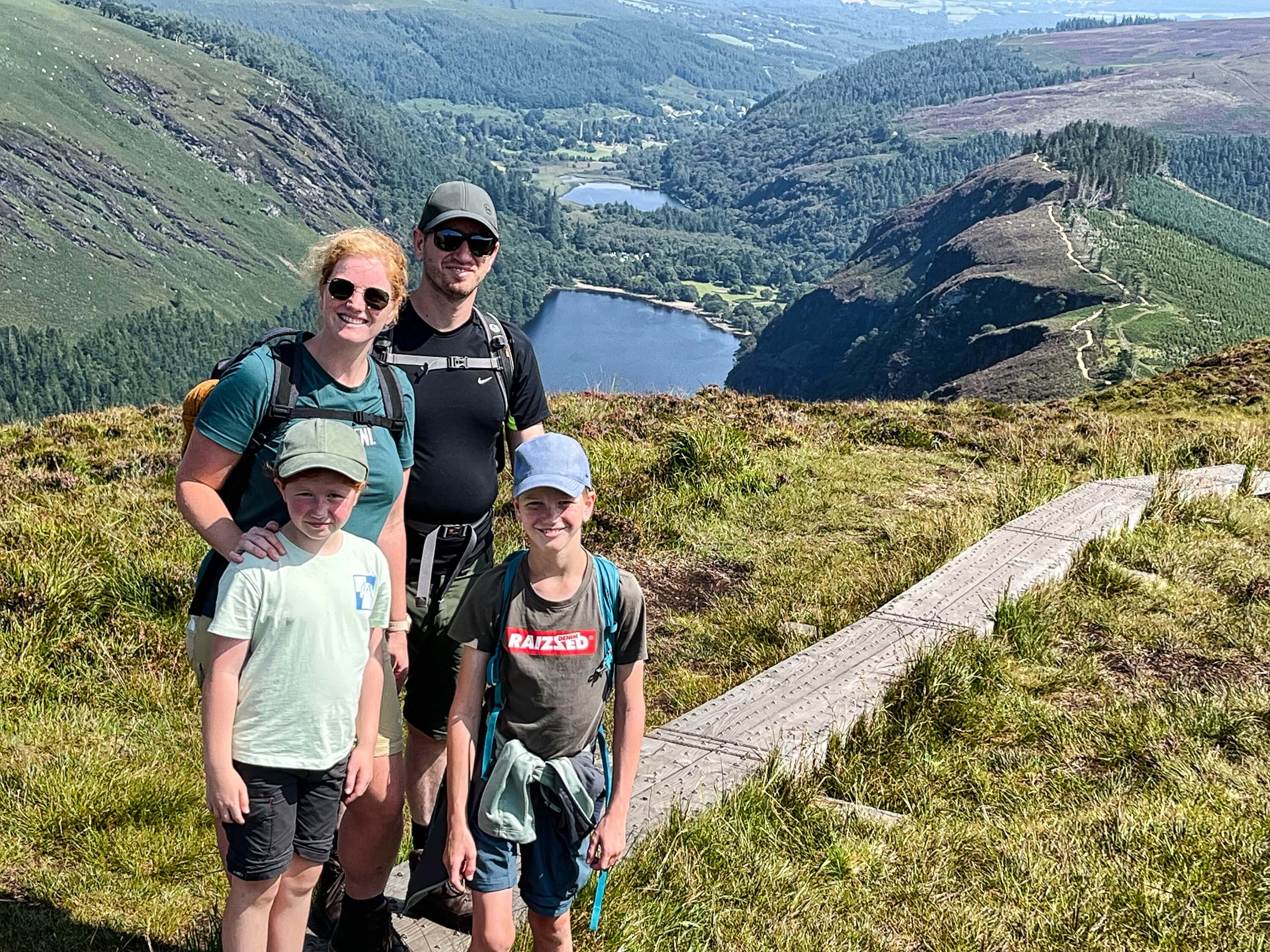 A family of hikers overlooking Glendalough