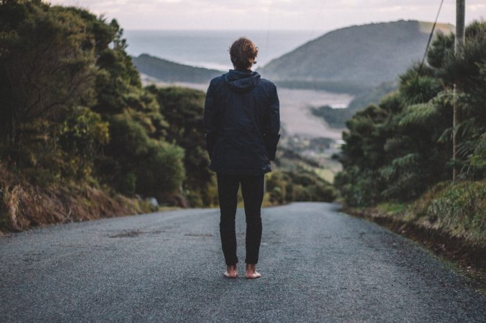 Standing barefoot on a road