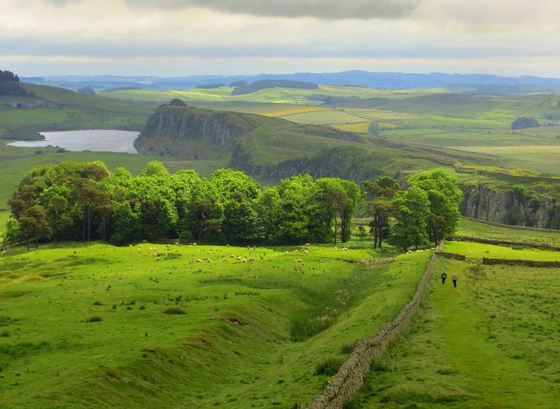 A view of Hadrian's Wall with English countryside in the background