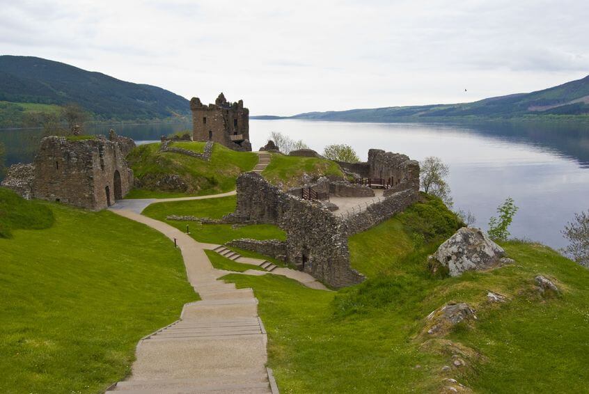castle_urquhart_surrounded_by_famous-loch-ness-hiking_scotland_hillwalk_tours