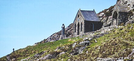 Maumean pilgrim site Connemara with church and statue of Saint Patrick