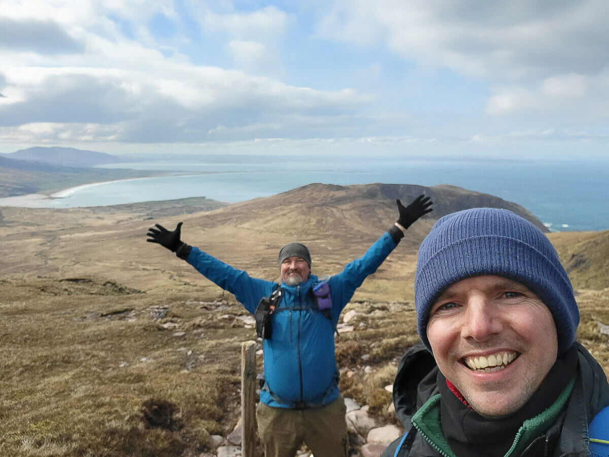 Hikers enjoying Ireland's Wild Atlantic coast on an Irish Coolcation on the Dingle Way