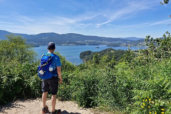 Hiker takes in a view of the river below on the Camino Portguese (Traditional Route)