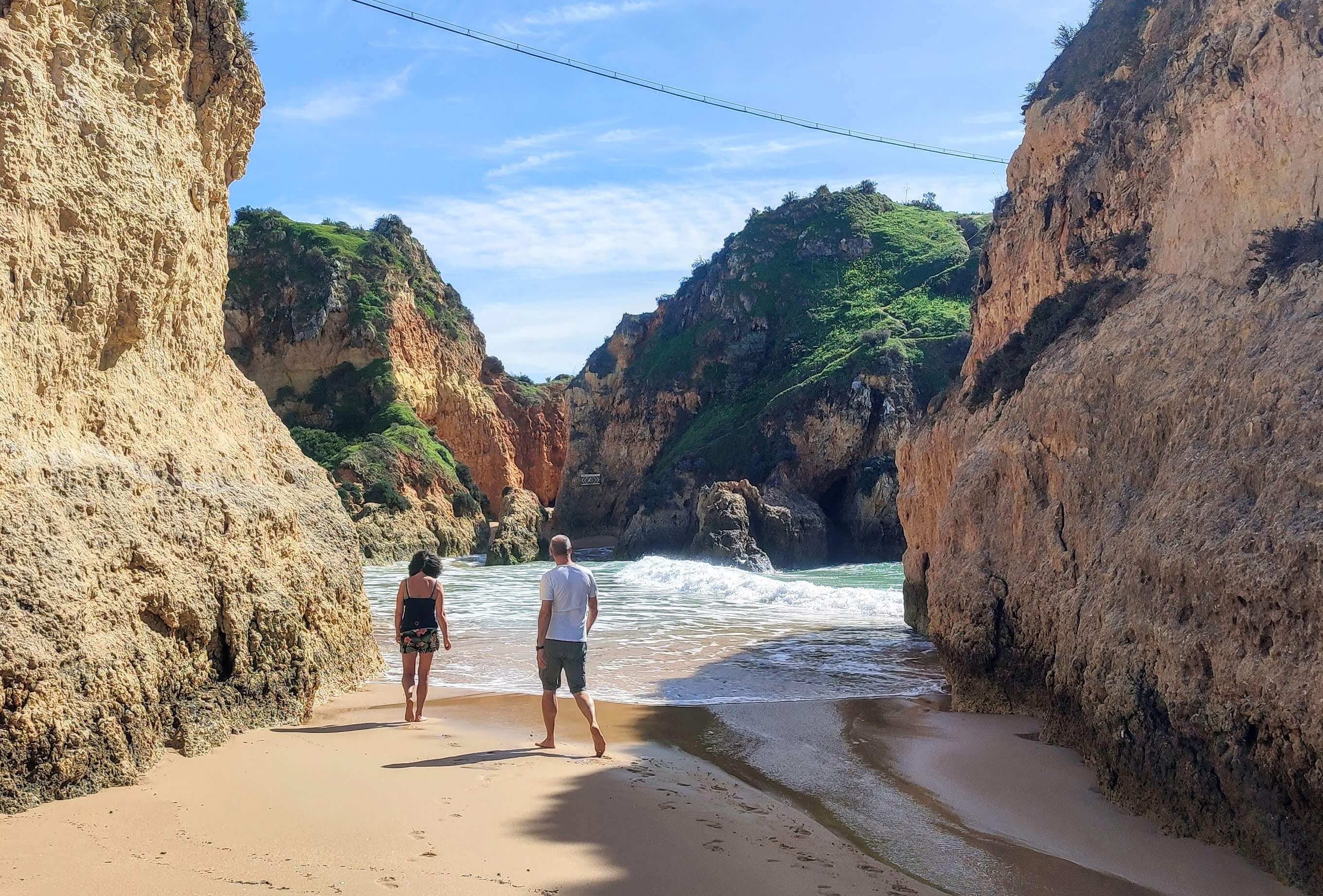  prainha couple walking between rock formation as tide comes in img 20250225 130105